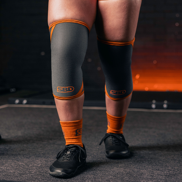 Grey/orange knee sleeves