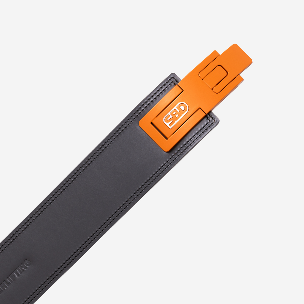 Orange buckle on grey belt